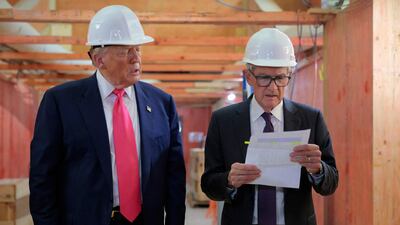 President Trump presents Jerome Powell with what Mr Trump called a list of cost overruns for the Fed’s $2.5 billion headquarters renovation. AFP