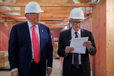 Donald Trump presents Jerome Powell with what he called a list of cost overruns for the Federal Reserve’s $2.5 billion headquarters renovation project on July 2025 in Washington. AFP