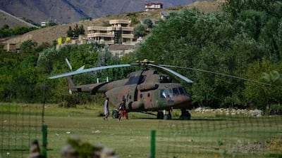An Afghan military helicopter is pictured in Panjshir province in Afghanistan on August 16, 2021. AFP