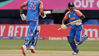 Suryakumar Yadav, right, and Shivam Dube run between the wickets. AP