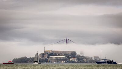 Clouds and fog shroud the Golden Gate Bridge and Alcatraz Island in San Francisco Bay. AP