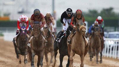 Patrick Dobbs riding Second Summer, right, wins the Godolphin Mile. Francois Nel / Getty Images