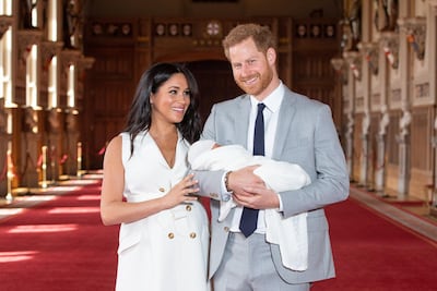 Megan, Duchess of Sussex and Prince Harry, Duke of Sussex, pose with their newborn son Archie Harrison Mountbatten-Windsor on May 8, 2019, at St George's Hall at Windsor Castle. Getty Images
