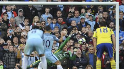 Everton's Maarten Stekelenburg, centre, saves a penalty from Manchester City's Sergio Aguero during their Premier League match at Etihad Stadium in Manchester on Saturday. Rui Vieira / AP Photo