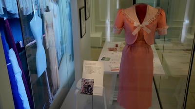 The dress and jacket that Princess Diana changed into on her wedding day made by designer David Sassoon is displayed in the Royal Style in the Making exhibition at Kensington Palace in London. AP Photo