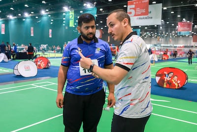 Badminton player Majid Abdullah with coach Ahmed Abdelrazek at the UAE Games. Victor Besa / The National