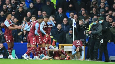 Aston Villa players react after defenders Matty Cash and Lucas Digne were struck by a bottle thrown from the crowd during their win against Everton at Goodison Park in Liverpool on January 22. AFP