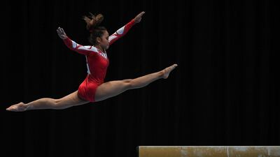Indonesia's Rifda Irfanaluthfi competes in the team artistic gymnastic balance beam event during the 29th Southeast Asian Games (SEA Games) in Kuala Lumpur. Mohd Rasfan / AFP