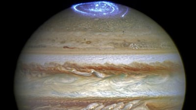 An ultraviolet aurora above the planet Jupiter, photographed by the Hubble space telescope, looks for all the world like a firework display to celebrate Eid. Nasa via AP