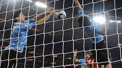 Had Uruguay's Luis Suarez, left, not stopped the ball with his hand - leading to a red card and an unsuccessful penalty for Ghana - his team would have been out of the World Cup by now.