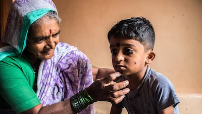 In India, even young children wear kohl. There’s a superstitious belief that wearing kohl wards off the evil eye. In this photo, Kusum is applying kohl to her grandson, Yash, 5.