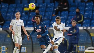 Arsenal's Joe Willock with Leeds United's Raphinha on Sunday. Reuters