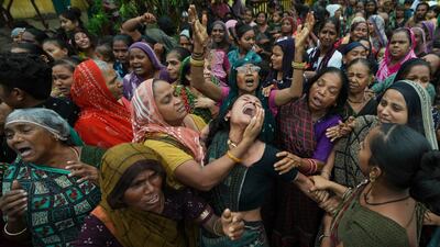 Family members and relatives of Akash Patni, a victim of the Air India plane crash, grieve during his funeral procession in Ahmedabad. AP