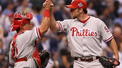 The Phillies' Brad Lidge, right, kept it tight against the Rays.