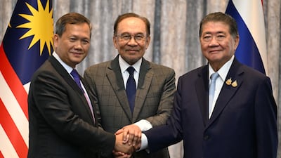 Malaysian Prime Minister Anwar Ibrahim brokered a truce between Cambodian Prime Minister Hun Manet, left, and Thailand's acting Prime Minister, Phumtham Wechayachai, in Putrajaya, Malaysia on Monday. EPA