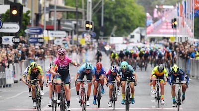 Italian rider Simona Frapporti (BePink Team) raises her arms after winning Stage 4 of the Adelaide Classic Street Circuit at the Women's 2020 Tour Down Under, on Sunday, January 19. EPA