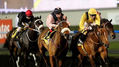 United Color, ridden by jockey James Doyle, galloped to the win in the fifth race at Meydan Racecourse in Dubai on Thursday night. Satish Kumar / The National