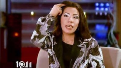 An actress parodies Egyptian television presenter Mona al Shazly during an episode of the comedy programme Talk Show.