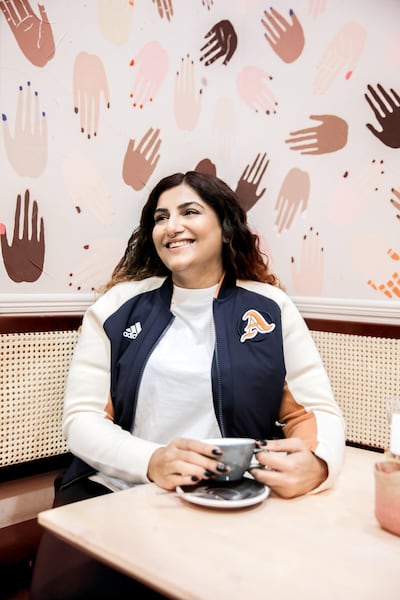 Body-positivity activist Lu D'Souza wearing the classic 'A' jacket, without the customised badge. Courtesy Adidas
