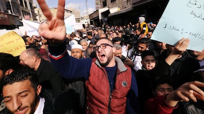 Demonstrators chant slogans during a protest against a government's agreement to import natural gas from Israel, in Amman, Jordan. The placard reads: "The enemy's gas is occupation". Reuters