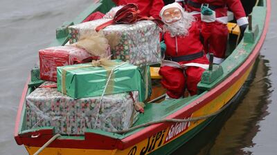 Several Santa Claus figures and lots of presents are on board a 'gamela', a traditional Galician fishing boat during preparations for Christmas, off Cambados' coast, Galicia, northwestern Spain. EPA