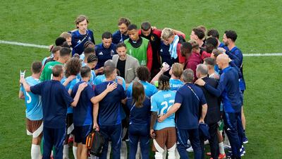 Belgium players with manager Domenico Tedesco at the end of the match against Ukraine. AFP
