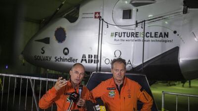 Swiss pilots Bertrand Piccard and Andre Borschberg announce the delay of the final leg of Solar Impulse’s round-the-world tour at Cairo International Airport on Saturday. The plane was expected to take off at 2am UAE time on Sunday. Khaled Desouki / AFP