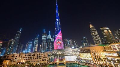 The tallest building also lit up in the colours and and beamed the badge of the UAE's Mars Mission. AFP