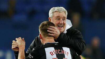 Newcastle's Matt Ritchie celebrates with manager Steve Bruce at the end of the match. Reuters