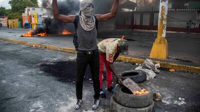 Protesters set up barricades in Port-au-Prince, Haiti. EPA