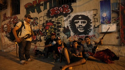 Libyan volunteers hold weapons near the court house in Benghazi August 23, 2011 as they prepare to go to Tripoli to fight Muammar Gaddafi's forces, REUTERS/Esam Al-Fetori