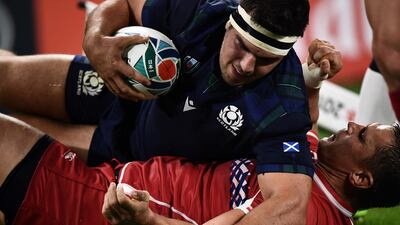 Scotland's hooker Stuart McInally (up) scores a try during the Japan 2019 Rugby World Cup Pool A match between Scotland and Russia at the Shizuoka Stadium Ecopa in Shizuoka. AFP