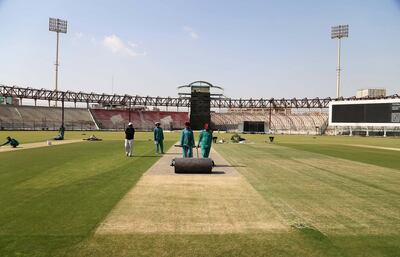 Workers prepare the ground at the National Stadium in Karachi, where the final of 2018 Pakistan Super League will be played. Shahzaib Akber / EPA