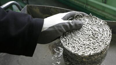 A worker processes a briquette of platinum shavings to cast ingots of 99.98 per cent pure platinum. By using more renewables, the miners may also ease pressure from investors wary of carbon-intensive industries as the shift from fossil fuels accelerates. Reuters