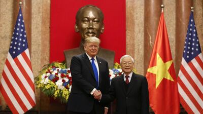 US President Donald Trump shakes hands with Vietnamese President Nguyen Phu Trong during their meeting at the Presidential Palace in Hanoi, Vietnam. Reuters