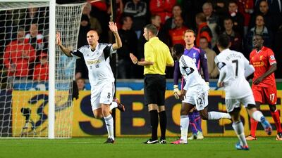 Jonjo Shelvey, left, of Swansea City celebrates scoring against Liverpool. He was just rewarded with a new contract. (Cal Sport Media via AP Images)