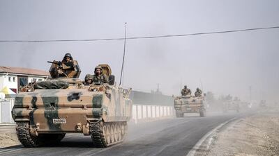 Turkish tanks and armoured personnel carriers move toward the Syrian border in Karkamis, Turkey, on August 25, 2016. Halit Onur Sandal/AP Photo