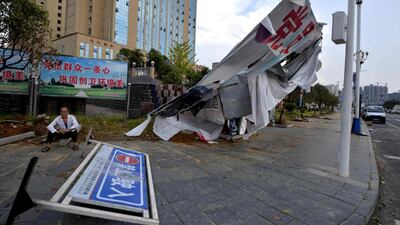 A fallen advertising board on a street due to winds by approaching Typhoon Nida at the town of Liaogao in Tongren, in southern China’s Guizhou province. AFP / STR
