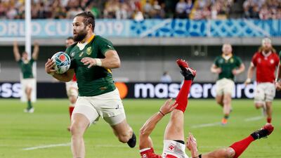 South Africa's Cobus Reinach runs in to score a try. AP
