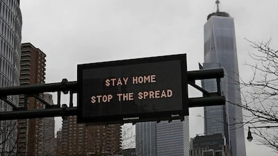 A traffic advisory sign on the West Side Highway instructs motorists to 'Stay Home Stop The Spread' in New York, New York, US. EPA