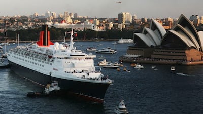 The QE2 passes her sister ship the Queen Mary II as she arrives in Sydney Harbour, February 2007. Getty Images