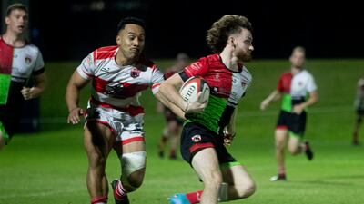 A Harlequins player runs with the ball during the game against the Tigers. Ruel Pableo for The National