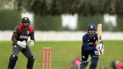 USA's Monank Patel hits a shot during his side's nine-wicket win over the UAE on Thursday in Dubai. Chris Whiteoak / The National