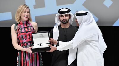Cate Blanchett after receiving her honorary award with Sheikh Mansoor bin Mohammed bin Rashid Al Maktoum and Diff chairman Abdulhamid Juma at the Dubai International Film Festival in 2017. Getty Images