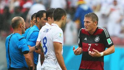 Bastian Schweinsteiger of Germany and Clint Dempsey of the United States react during their match on Thursday at the 2014 World Cup. Robert Cianflone / Getty Images