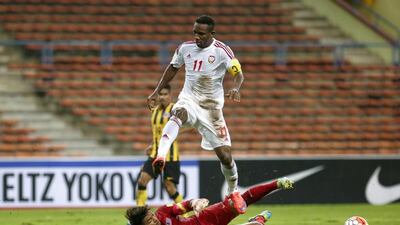 Ahmed Khalil of UAE (front) duels for the ball with Malaysia goalkeeper Mohd Izham Tarmizi (back) during the FIFA World Cup 2018 Asian qualifying soccer match between Malaysia and UAE at Shah Alam Stadium, outside Kuala Lumpur, Malaysia, 17 October 2015. EPA/FAZRY ISMAIL