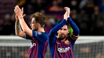 Lionel Messi and his teammates celebrate at the end of the game. Lluis Gene / AFP