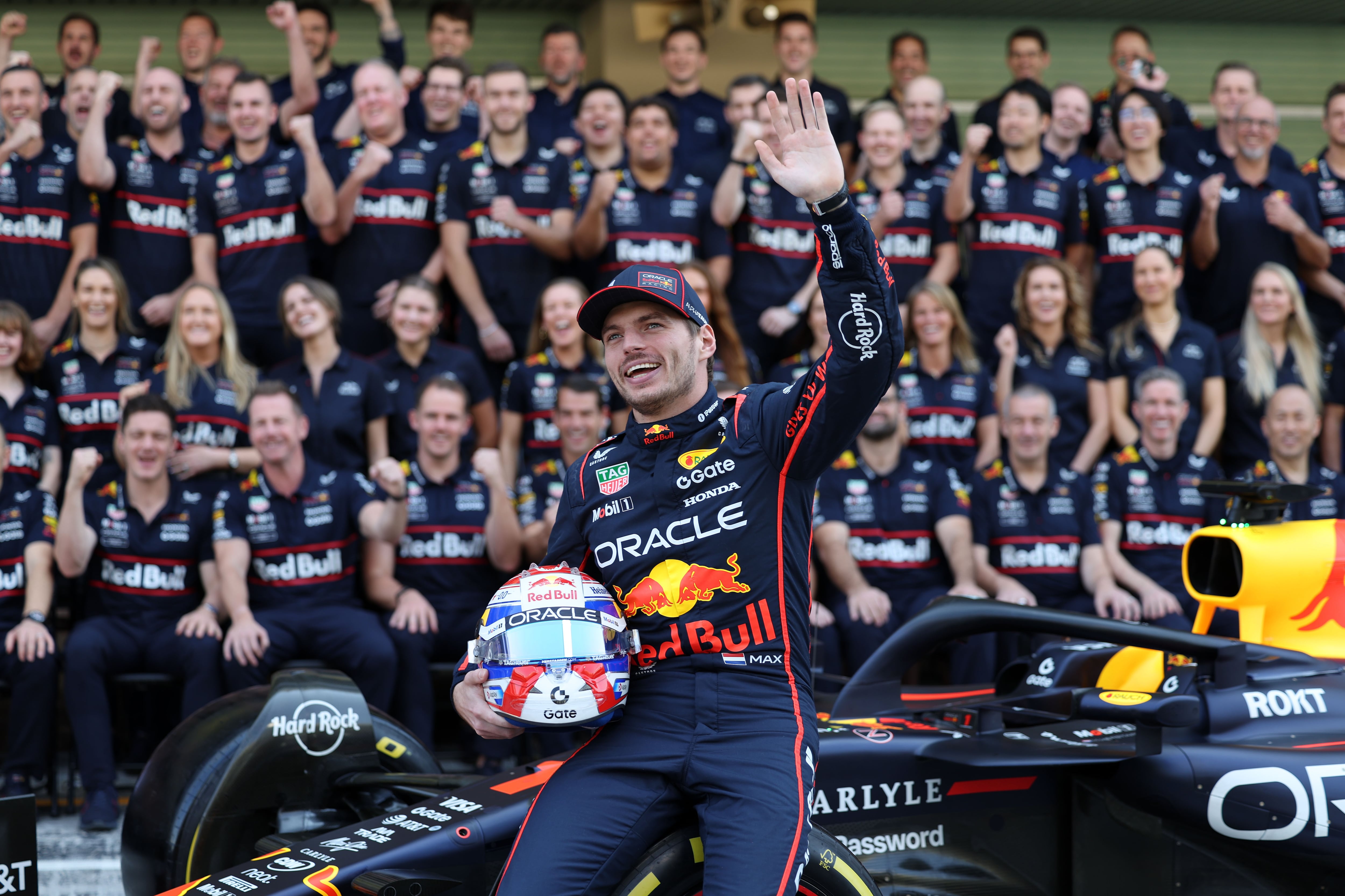 Red Bull driver Max Verstappen has his picture taken with the rest of the team at the Yas Marina Circuit ahead of the 2025 Abu Dhabi Grand Prix