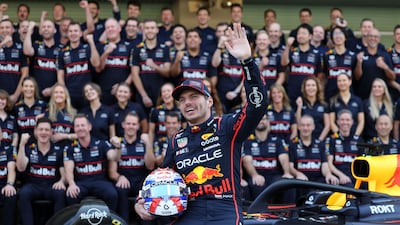 Red Bull driver Max Verstappen has his picture taken with the rest of the team at the Yas Marina Circuit ahead of the 2025 Abu Dhabi Grand Prix. All images Chris Whiteoak / The National