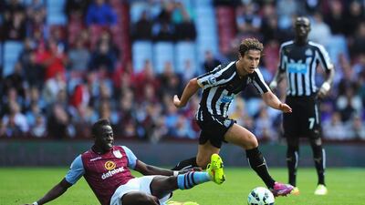 Daryl Janmaat of Newcastle United is tackled by Aly Cissokho of Aston Villa during the Barclays Premier League match between Aston Villa and Newcastle United at Villa Park on August 23, 2014 in Birmingham, England. (Photo by Chris Brunskill/Getty Images)